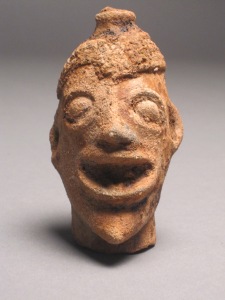 Head of man wearing a cap from Koma Land